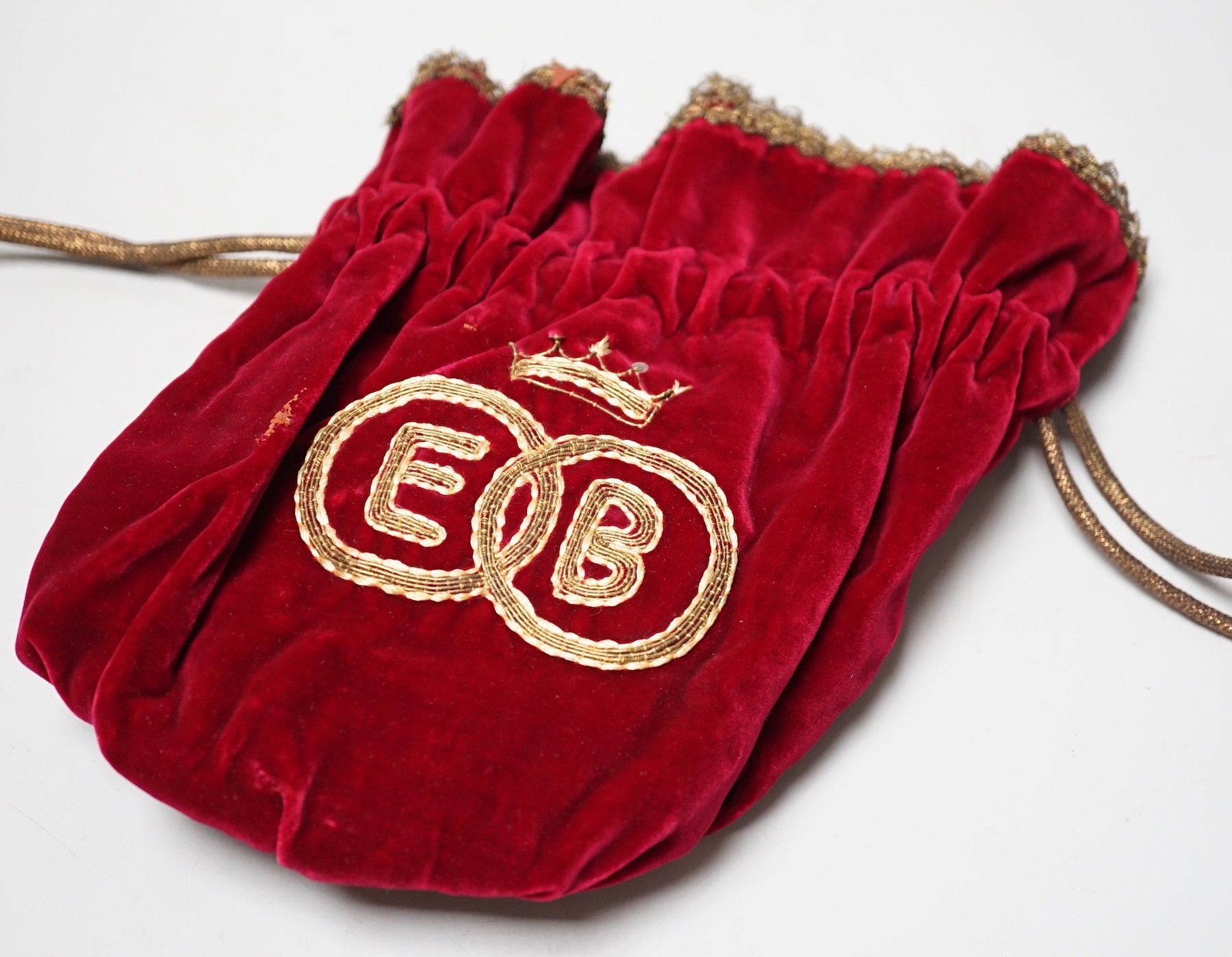 A peeress’s Coronation tiara and/or sandwich bag, 1953, velvet and gold-thread bearing initials of invited peeress, complete with original mirror plate, 22cm high, with provenance